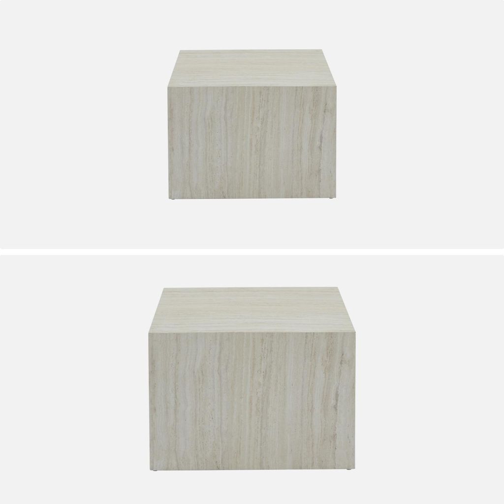 Two identical white cube-shaped side tables with a marble-like texture are shown against a white background.
