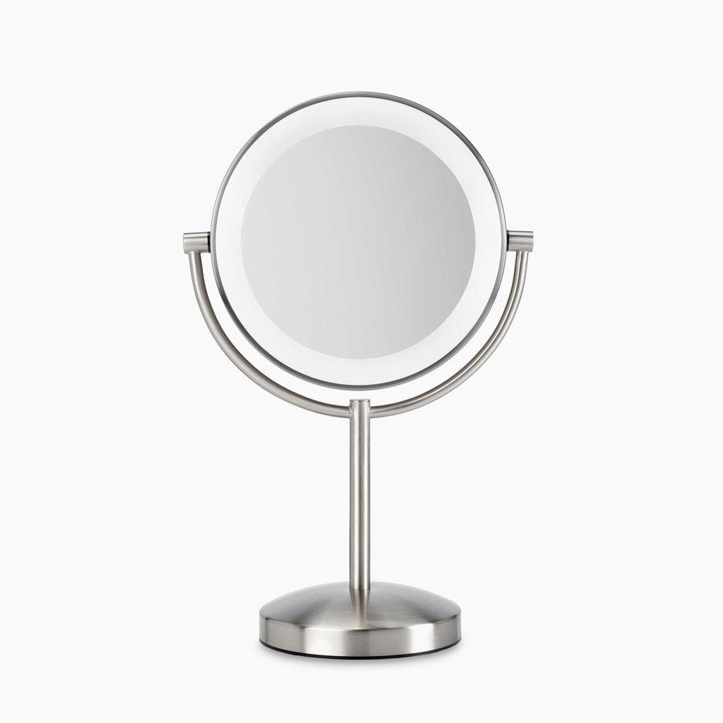 A silver makeup mirror with LED lighting on a white background.