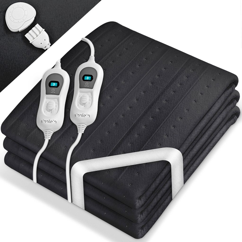 A folded black electric heated blanket with two white controllers and cords.