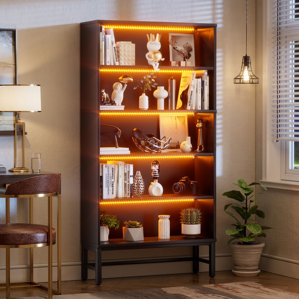 A display cabinet filled with decorative items, placed next to a desk and chair.