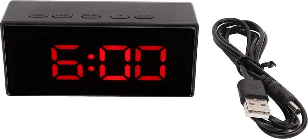 A black digital alarm clock with a red LED display showing 6:00, and a black USB charging cable are shown on a white background.