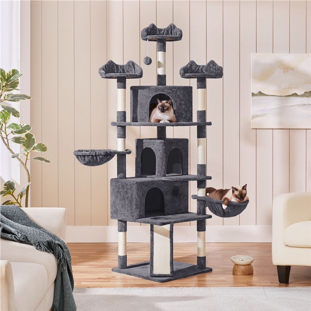 A multi-level cat tree with two cats, placed in a living room setting.