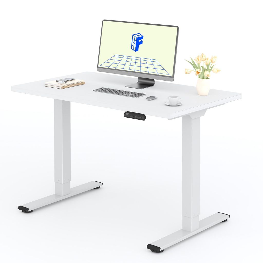 A white standing desk with a monitor, keyboard, mouse, and a small vase of flowers.