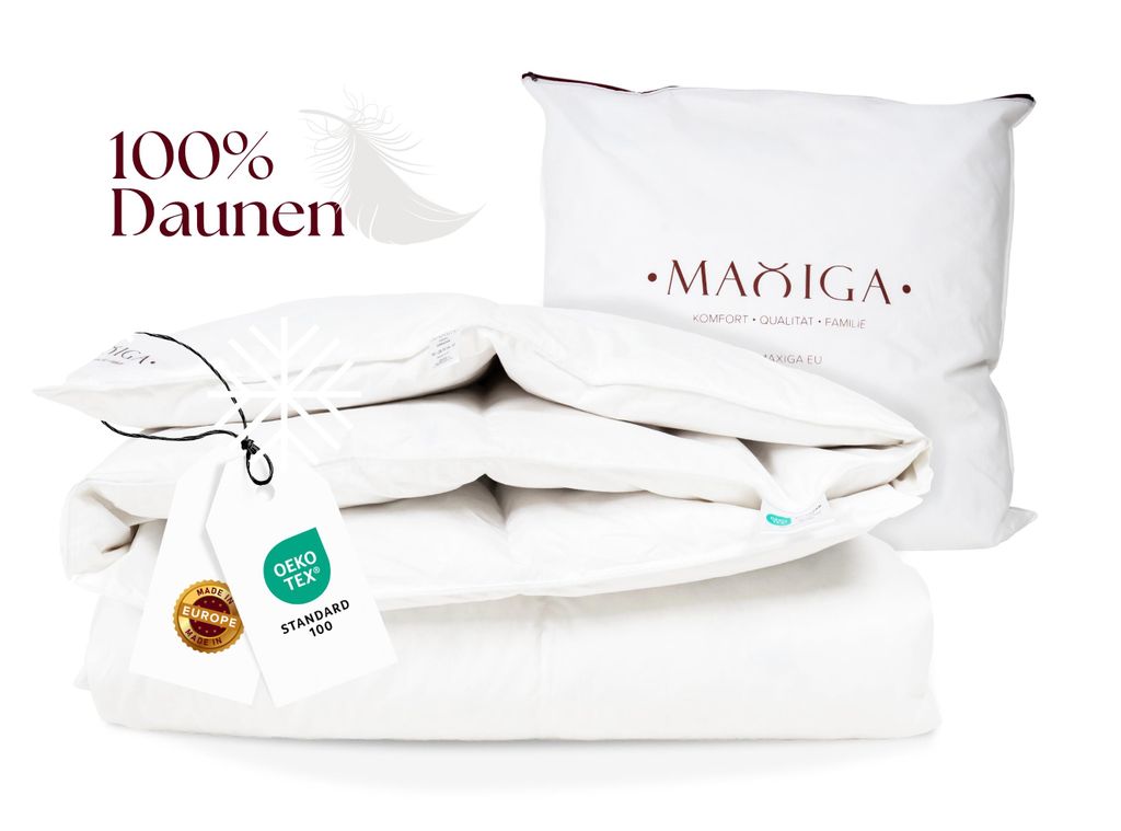 A stack of white bedding products, including a folded duvet and a pillow in its packaging, with product tags attached.
