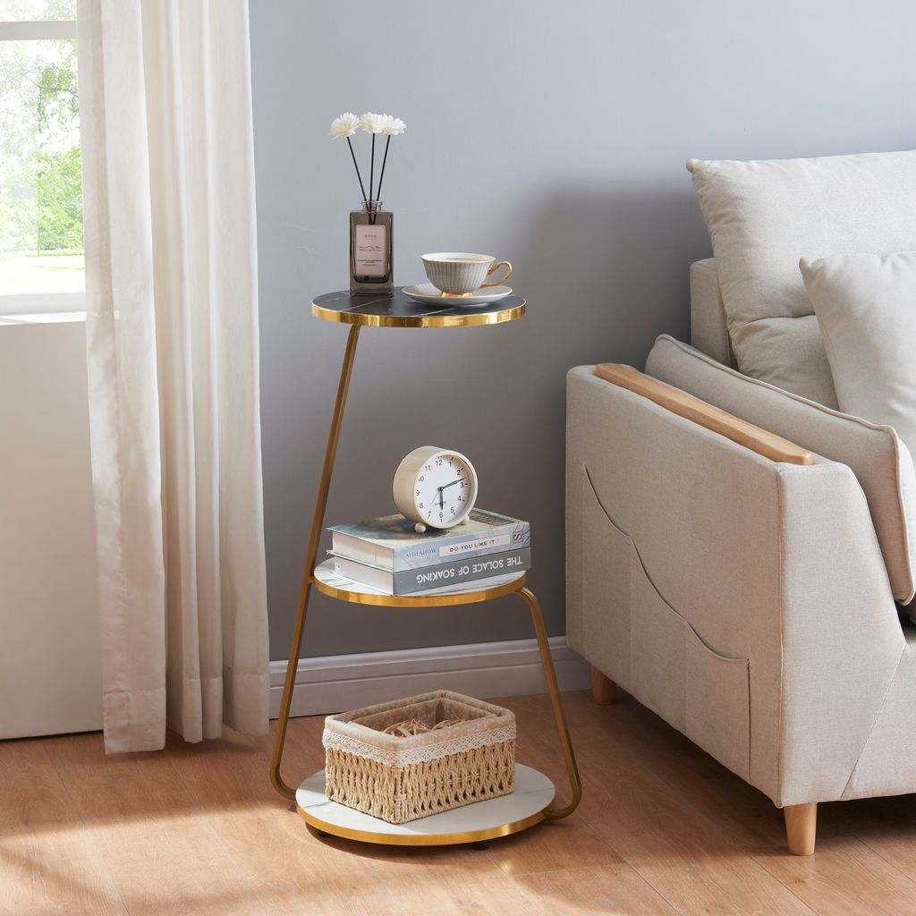 A side table with decorative items next to a sofa.