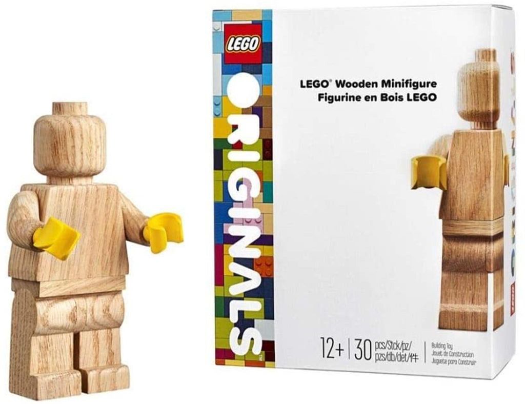 A wooden LEGO minifigure and its packaging.