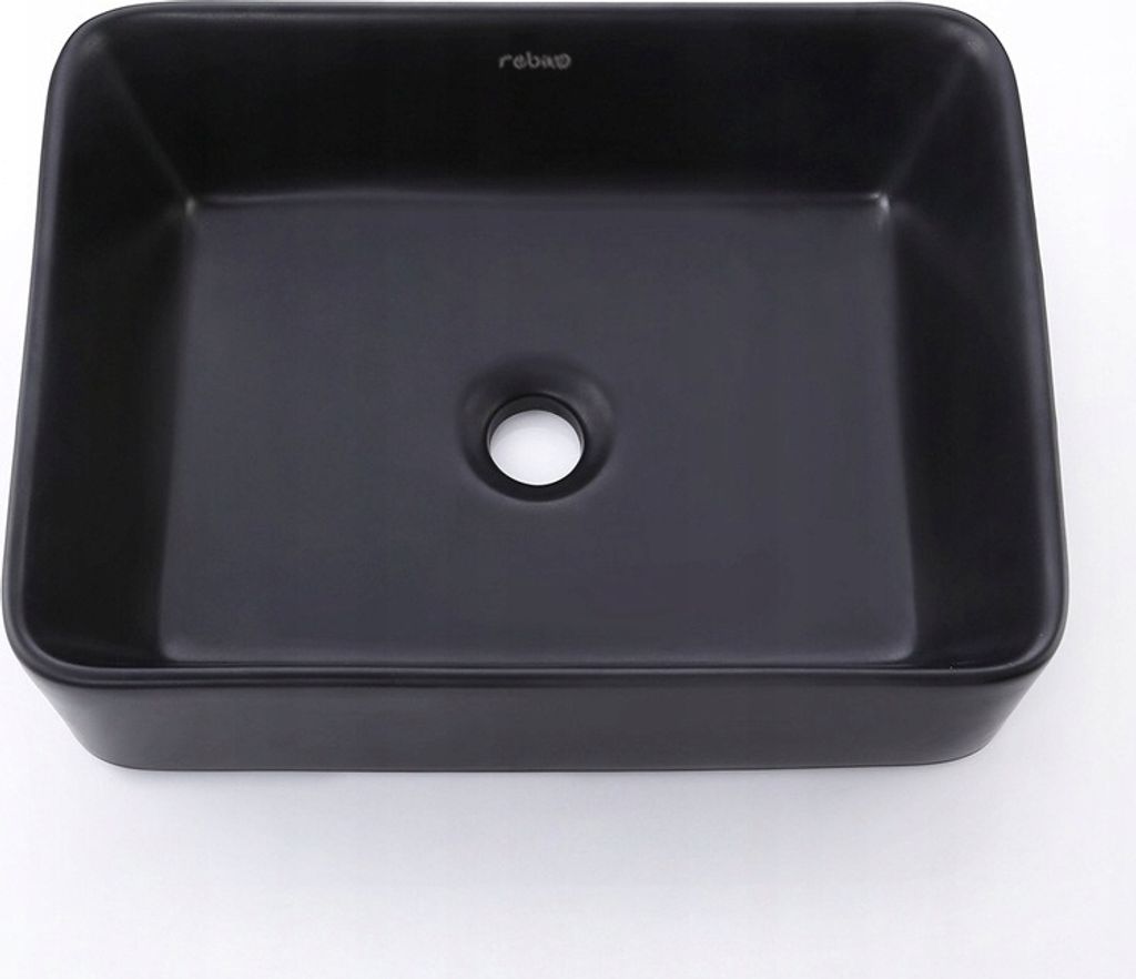 A black rectangular washbasin with a drain hole in the center, placed on a white background.