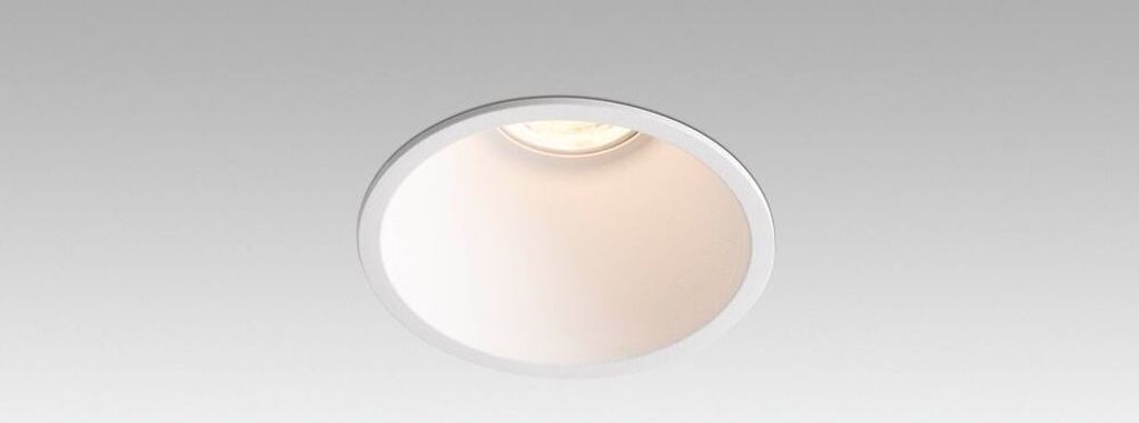 A recessed ceiling light fixture against a plain background.