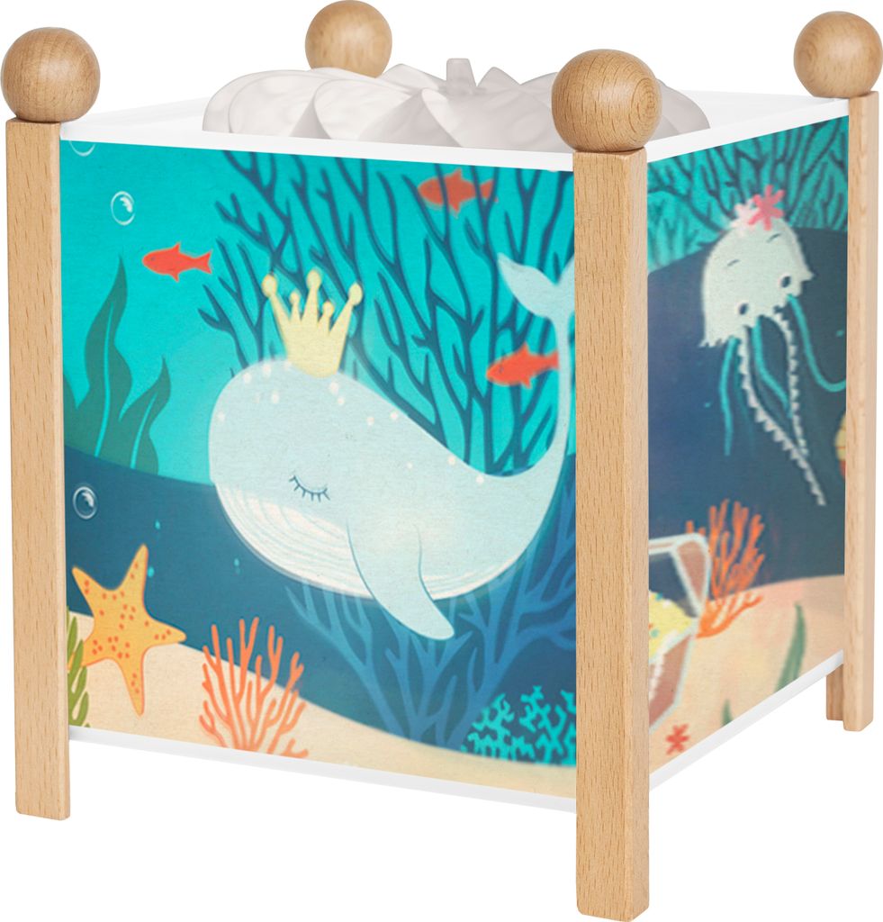 A square-shaped night light with a colorful ocean-themed illustration on its sides, featuring a whale, jellyfish, and underwater scenery. It has wooden posts and spherical wooden accents on top.
