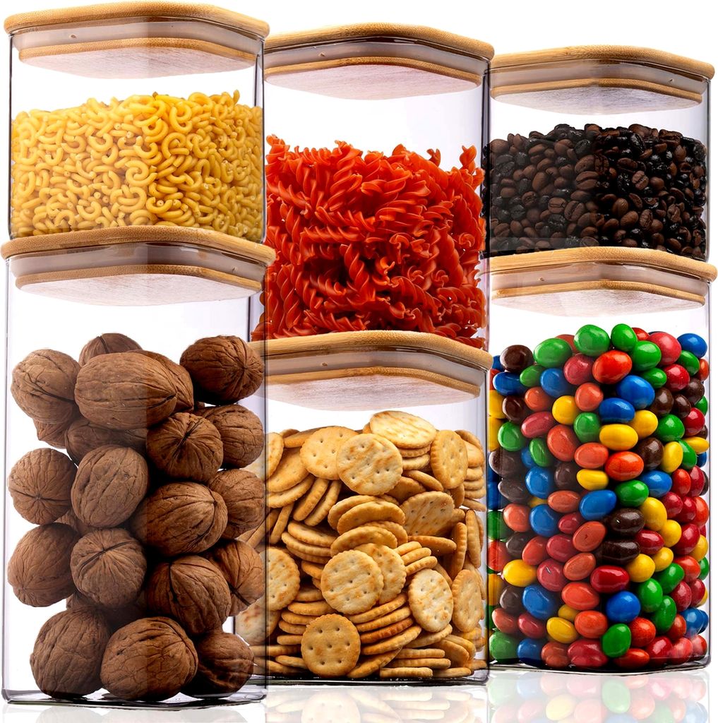 Six clear glass storage jars with bamboo lids, filled with different food items, arranged in a grid.