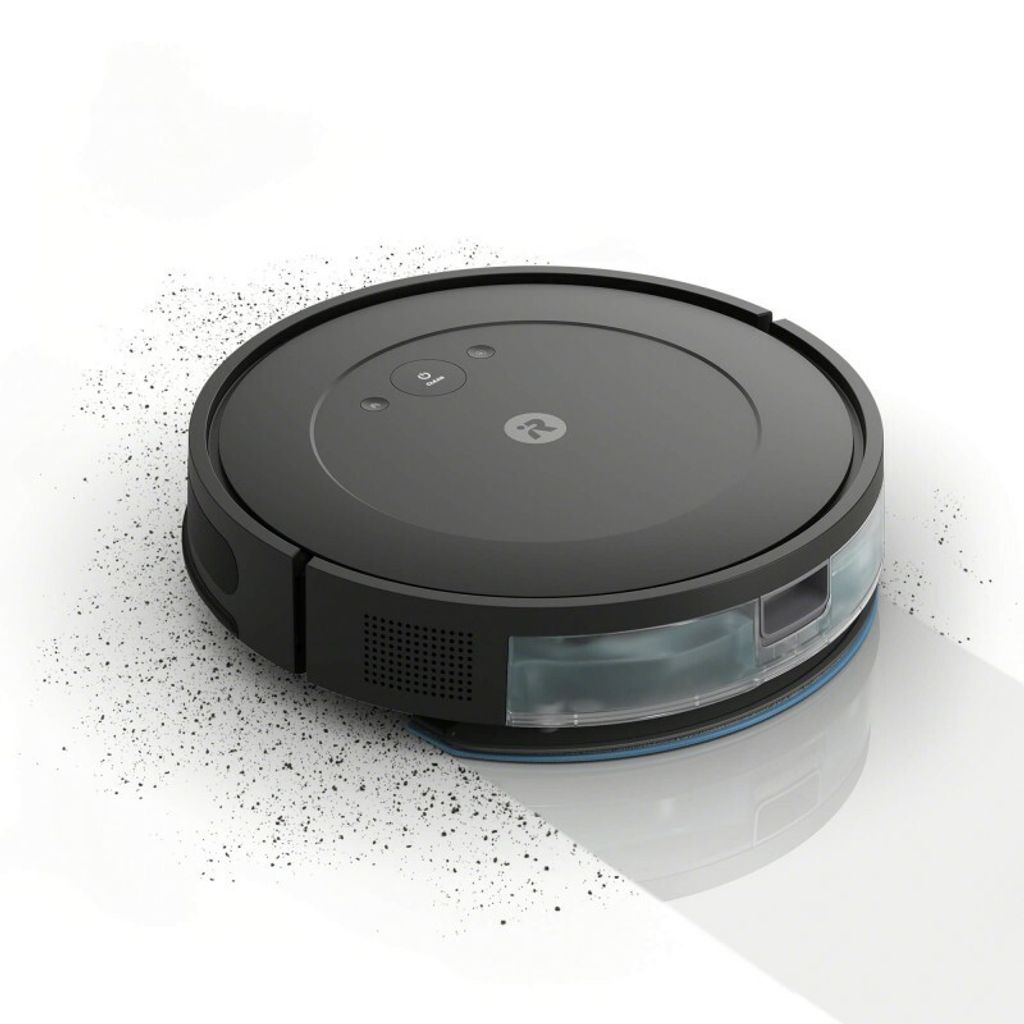 A black robot vacuum cleaner is shown on a white background, with dust particles scattered around it.