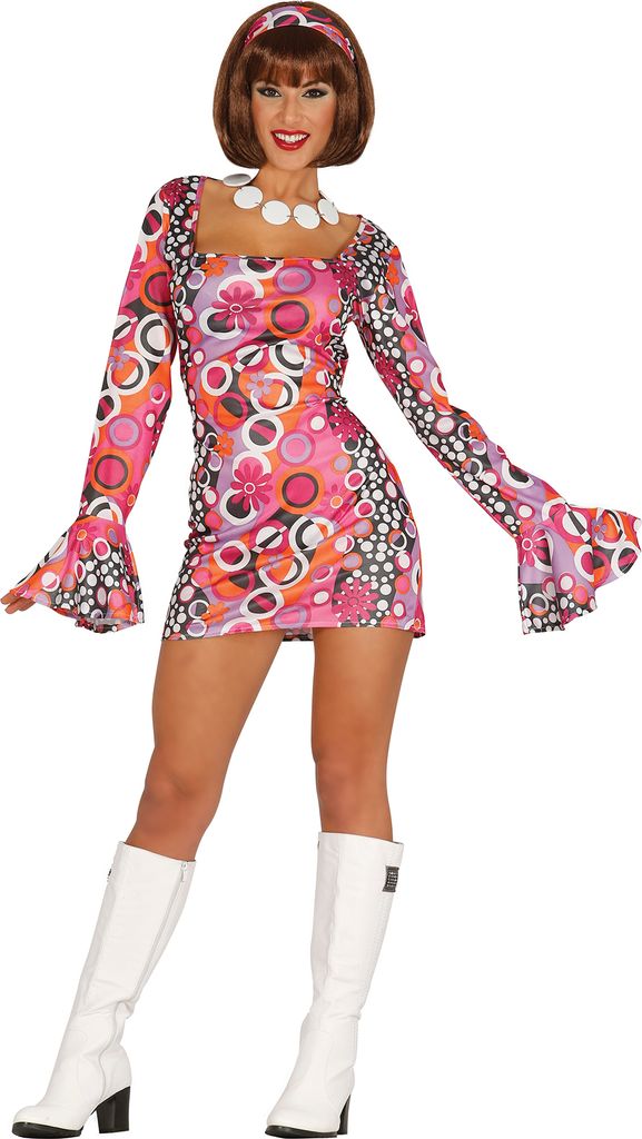 A woman wearing a 70s-style disco costume.
