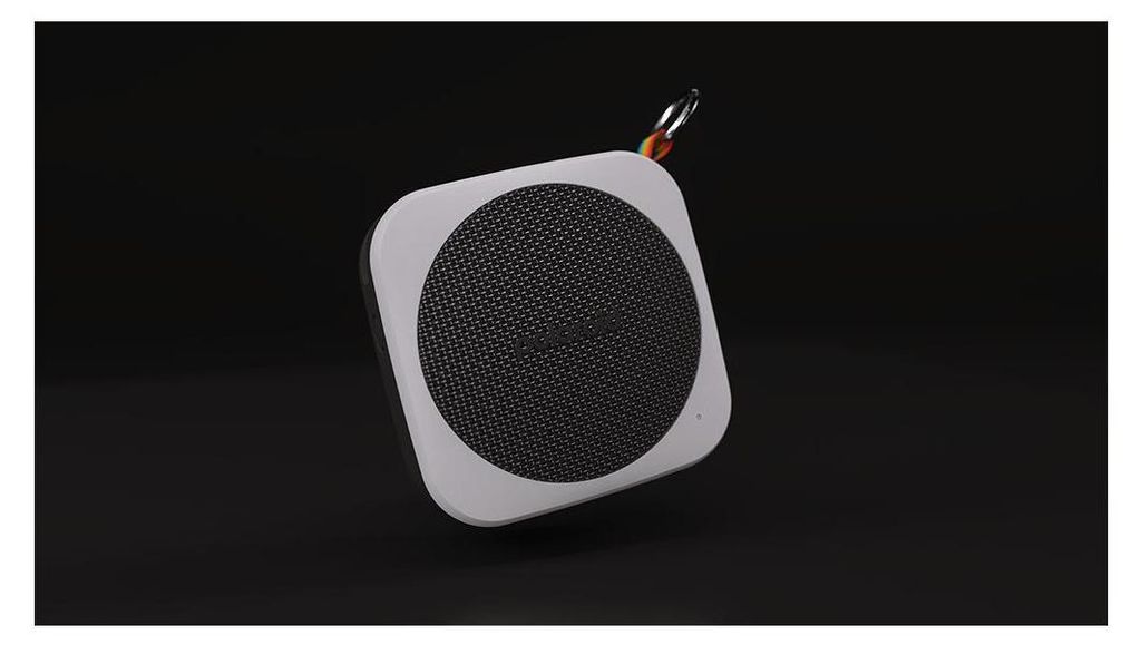 A square portable Bluetooth speaker with a circular mesh speaker grille is shown against a black background.
