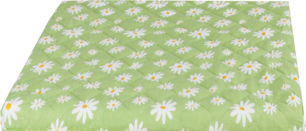 A quilted fabric with a green background and a pattern of white daisies with yellow centers.