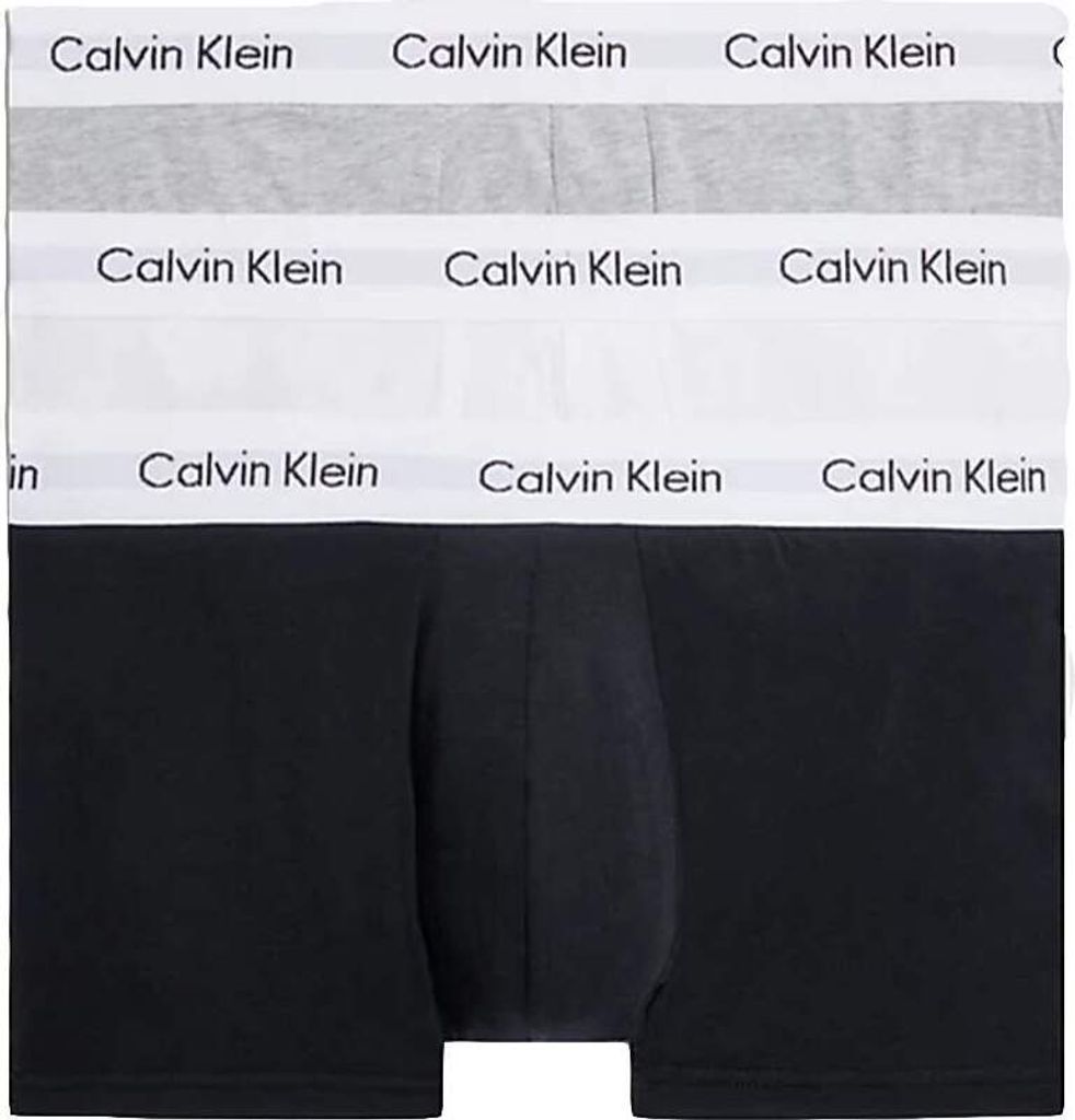 A stack of Calvin Klein boxer briefs in different colors.
