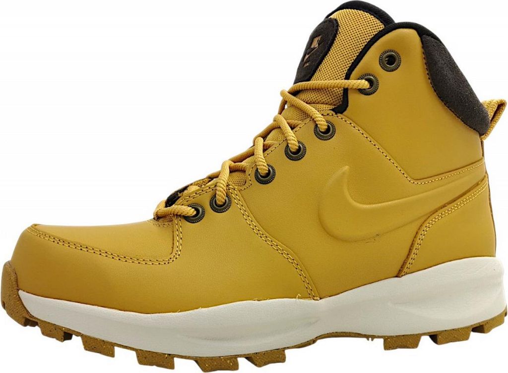 A side view of a single brown Nike Manoa boot against a white background.