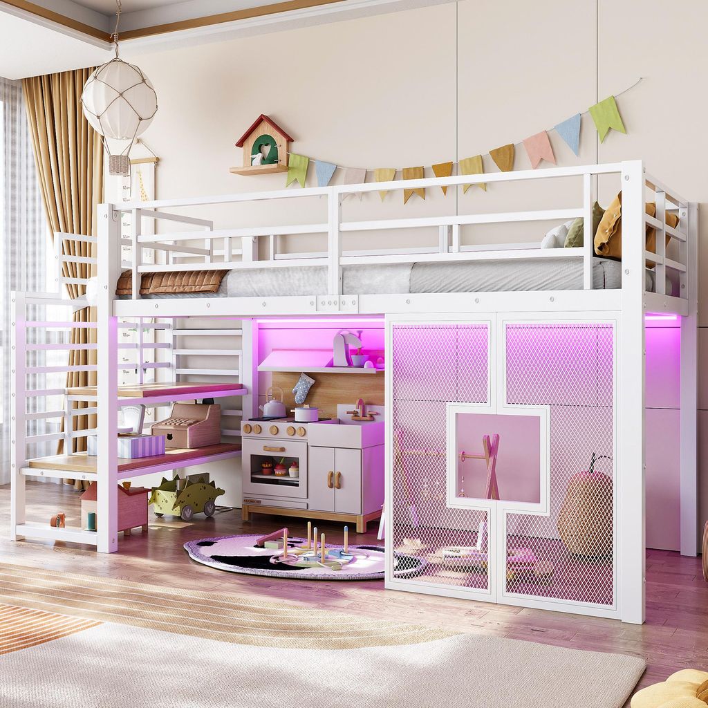 A child's bedroom featuring a white loft bed with integrated play kitchen and storage, illuminated by pink LED lights.