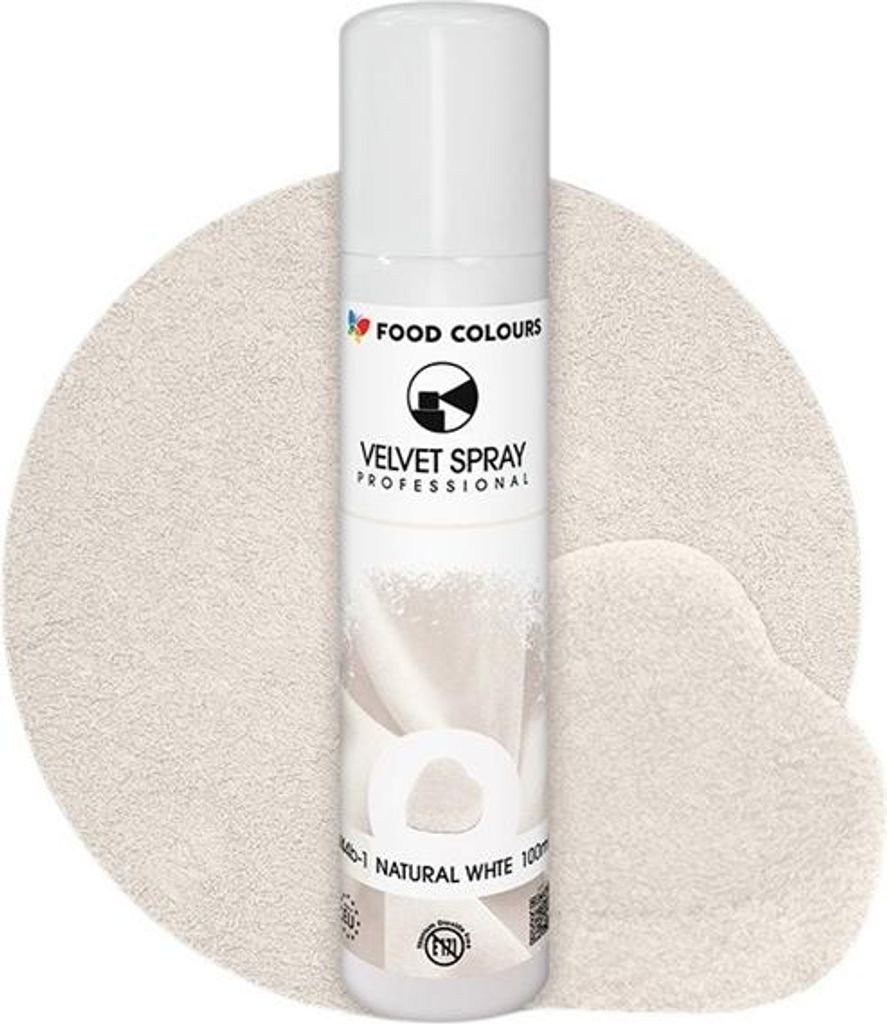 A white spray can of food coloring is placed on a textured, light-colored background.