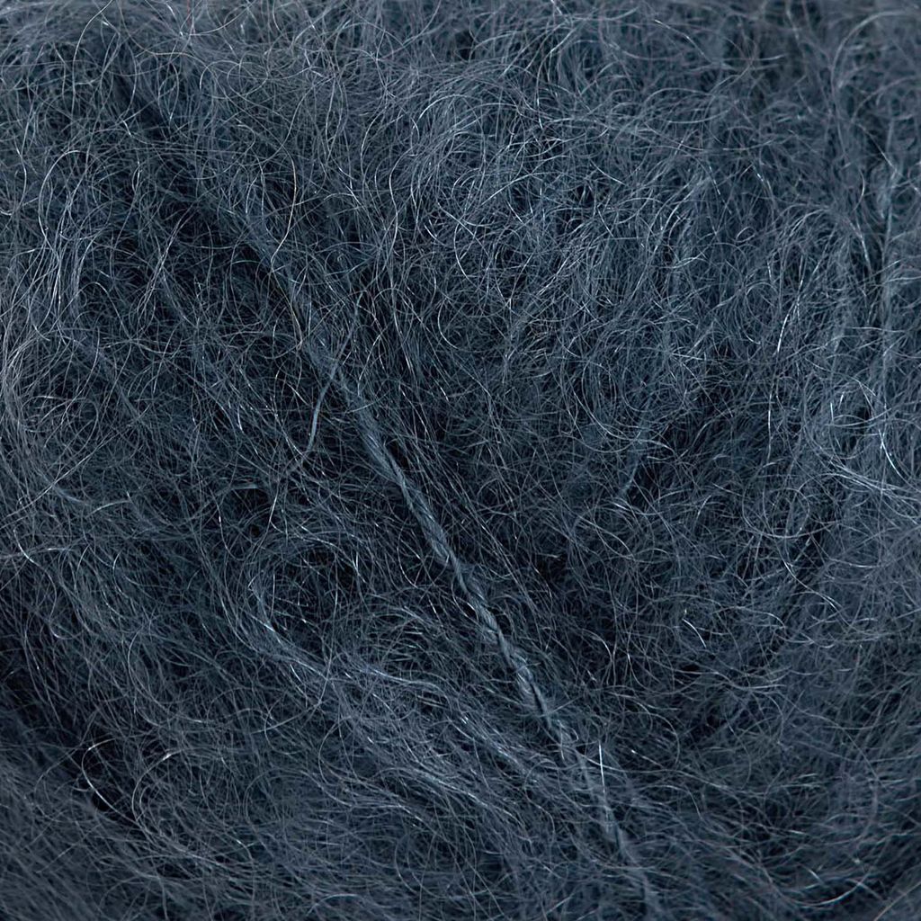 A close-up view of dark blue yarn.