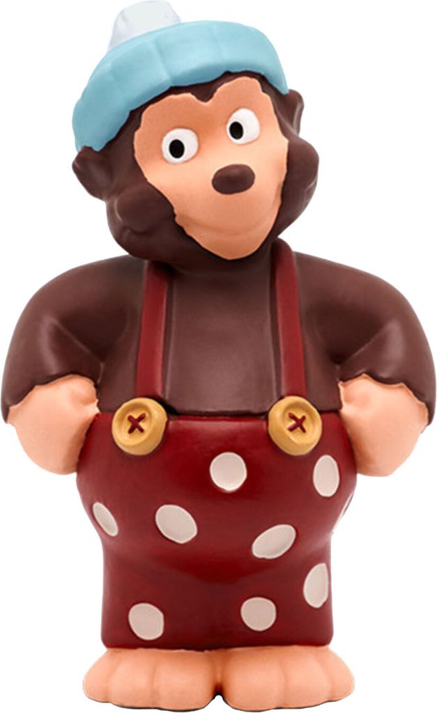 A toy monkey figurine wearing a hat and overalls.
