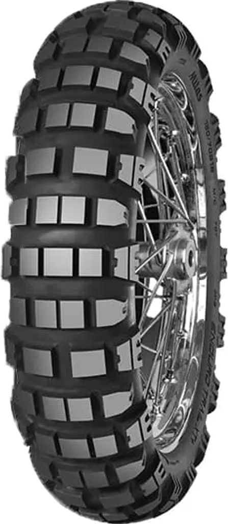 A motorcycle tire on a white background.