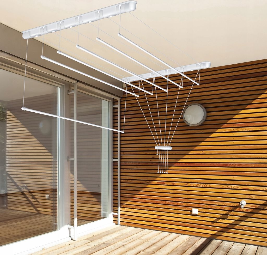 A ceiling-mounted clothes drying rack with multiple rods, installed on a balcony or patio with wooden siding and a glass door.