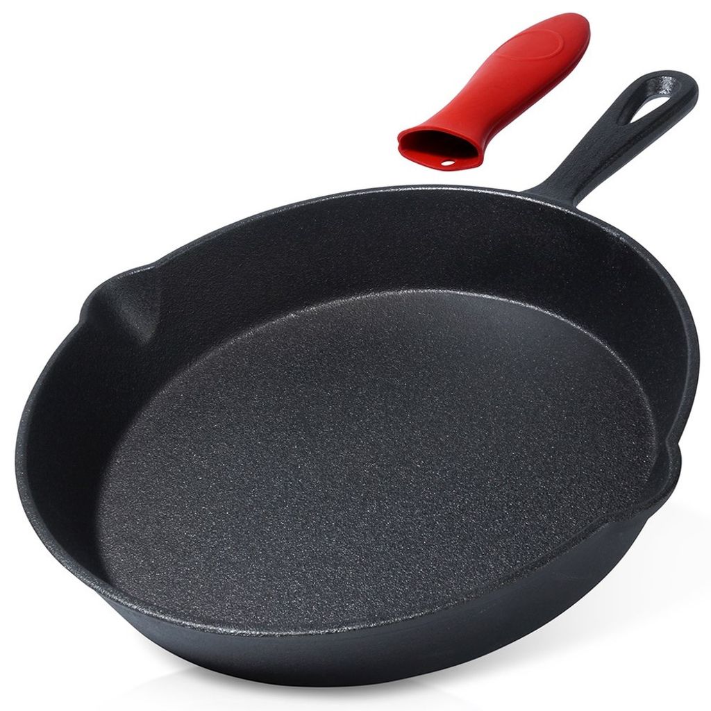 A black cast iron skillet with a red silicone handle cover is shown against a white background.