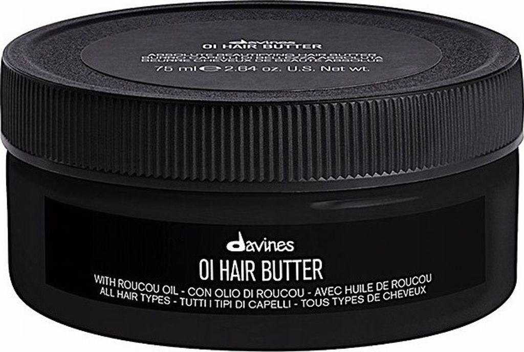 A black jar of Davines OI Hair Butter is shown against a black background.