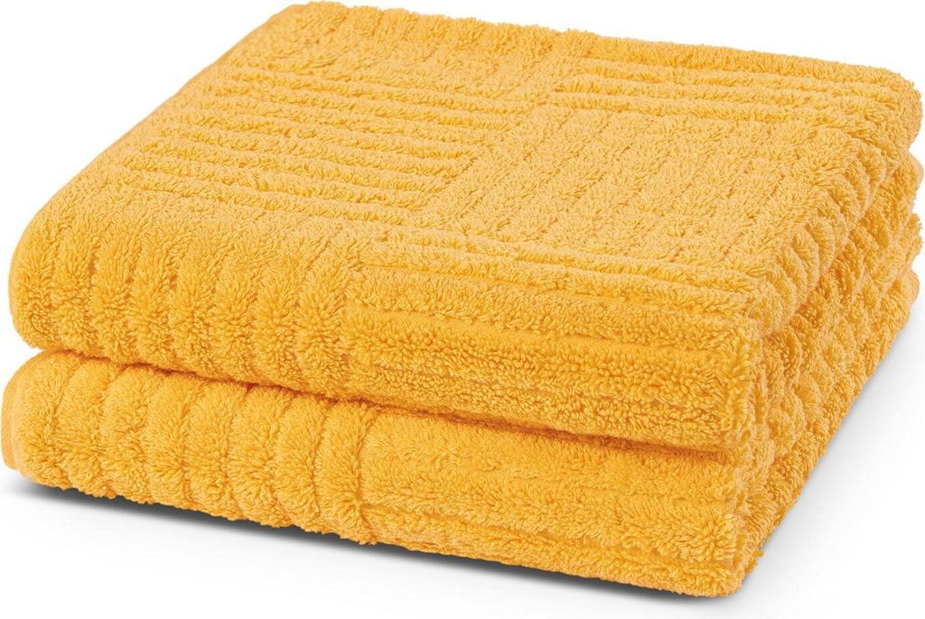 Two folded yellow towels stacked on a white background.