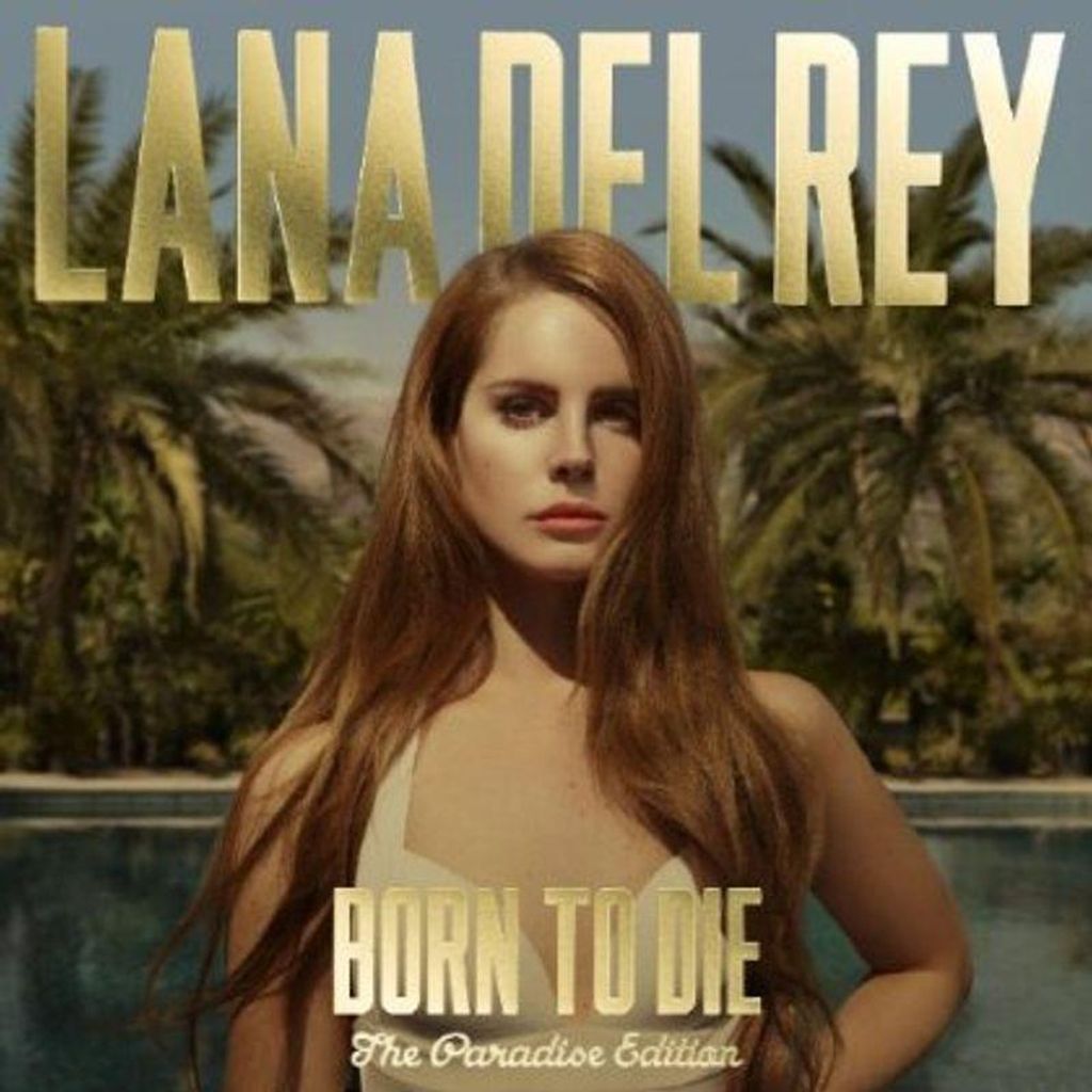 Lana Del Rey posing in front of palm trees and a pool, with album title text.