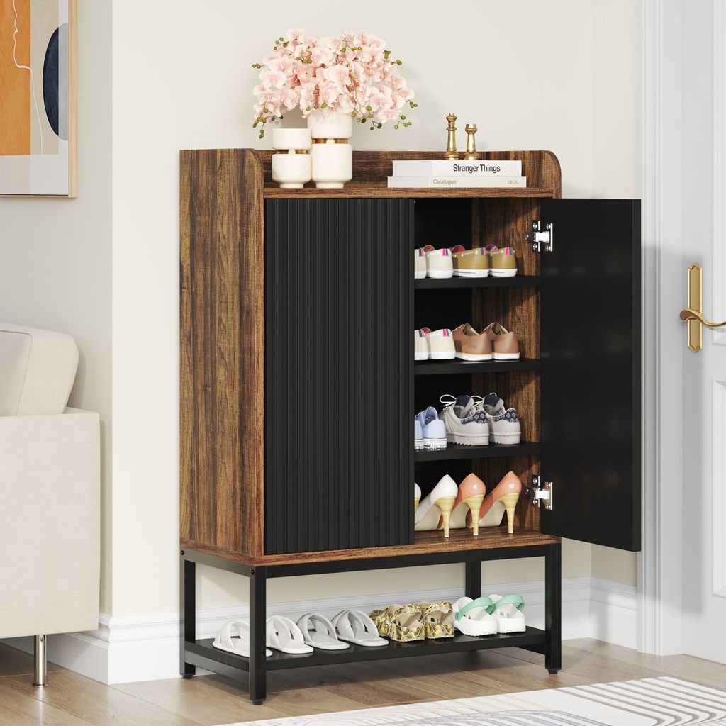 A shoe cabinet with shoes and decorative items in an entryway.