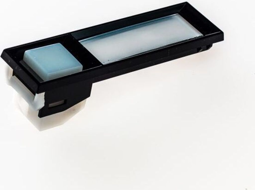A close-up studio shot of a black electronic component with a light blue button and a translucent rectangular display area, set against a white background.