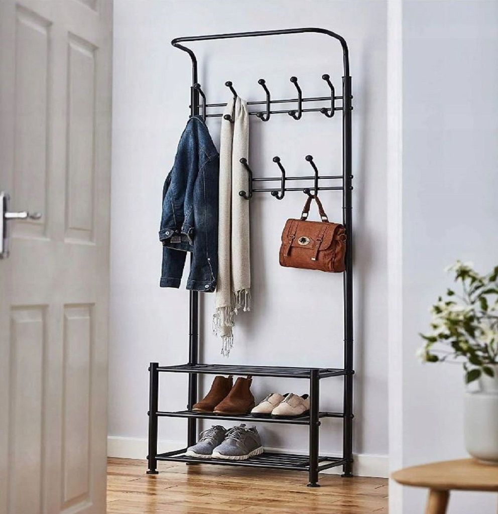 A coat rack with shoes and accessories in an entryway.