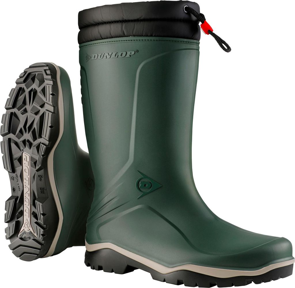 A pair of green Dunlop winter boots shown against a white background. One boot is standing upright, and the other is lying on its side, showing the sole.