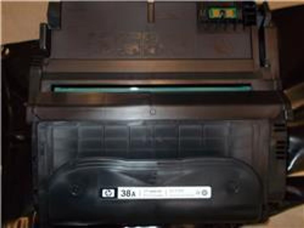 A close-up view of a black HP toner cartridge.