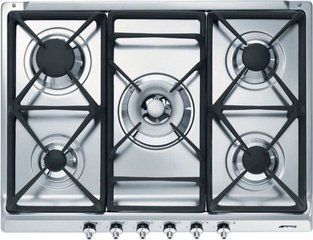 A top-down view of a stainless steel gas cooktop with five burners.