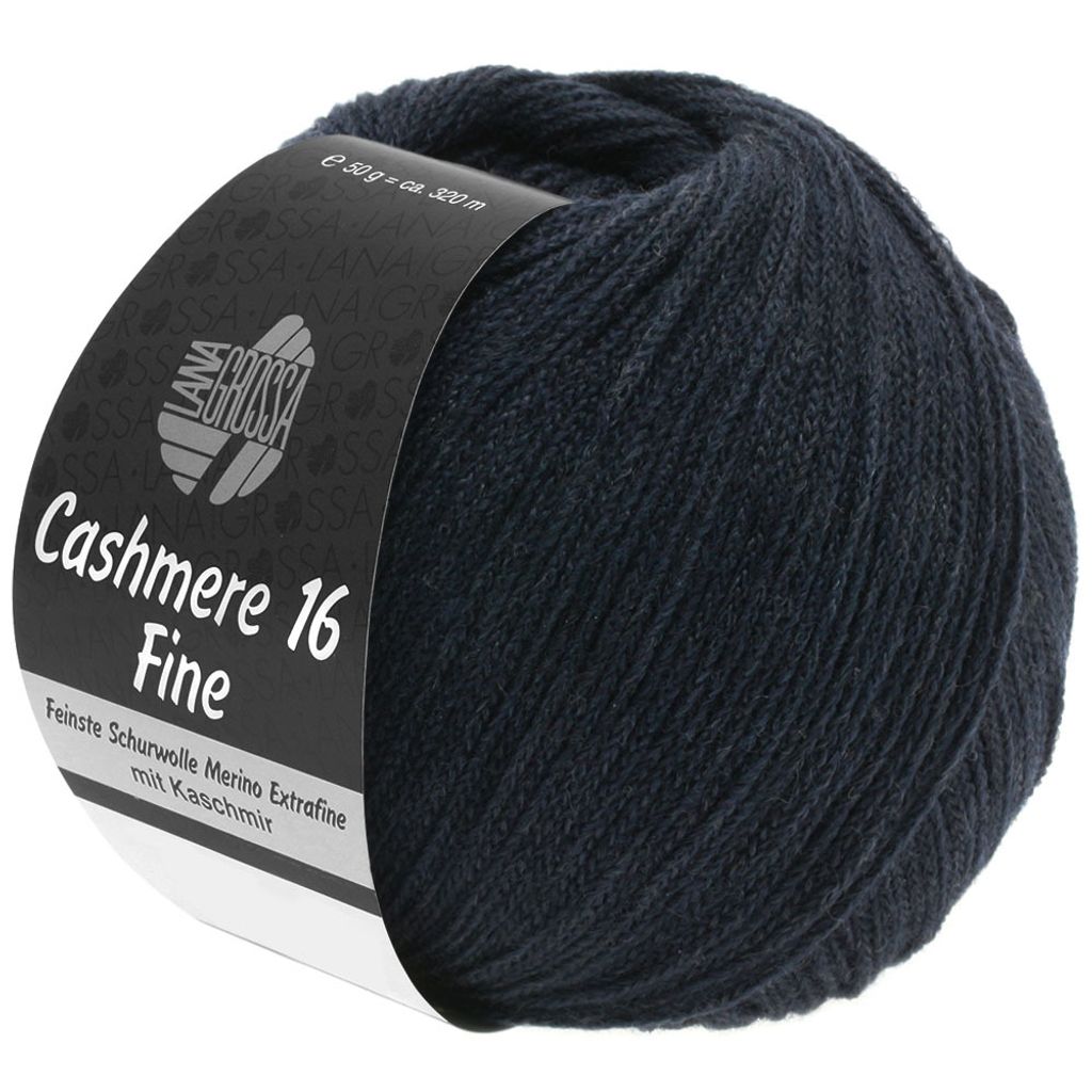 A ball of dark blue yarn with a black label wrapped around it.