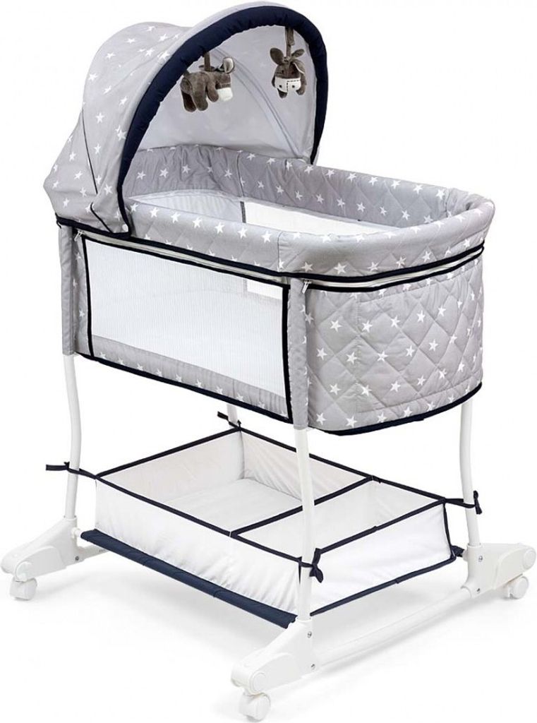 A baby bassinet with a canopy and a storage basket underneath, shown on a white background.