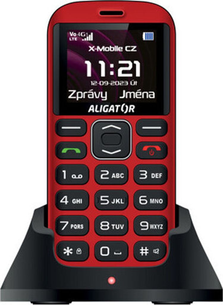 A red Aligator A720 4G senior mobile phone is displayed in a black charging dock against a light gray background.