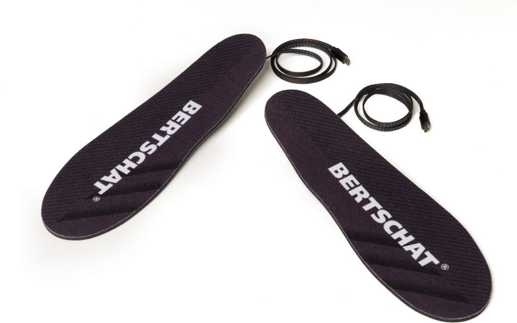 Two black insoles with white text and black wires are laid out on a white background.