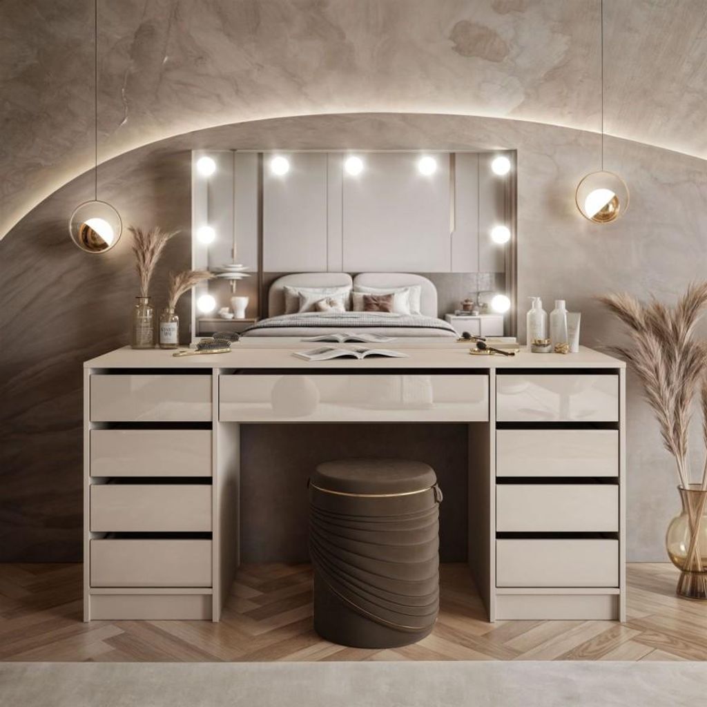 A modern bedroom with a vanity table and bed.