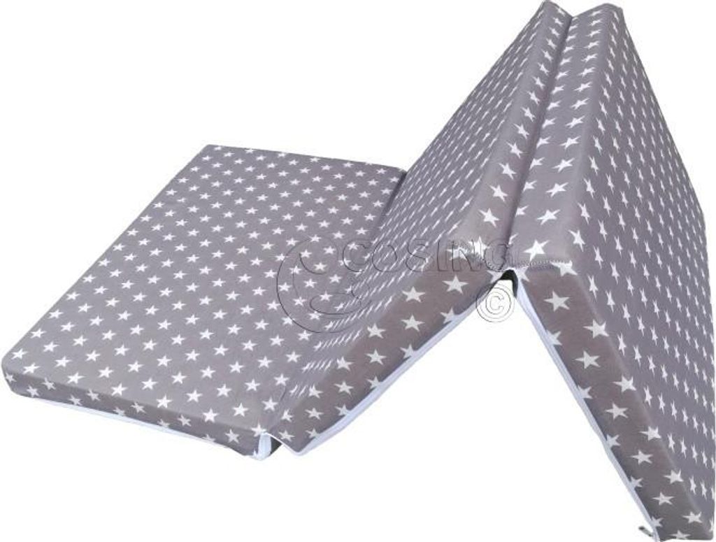 A folded mattress with a star pattern.