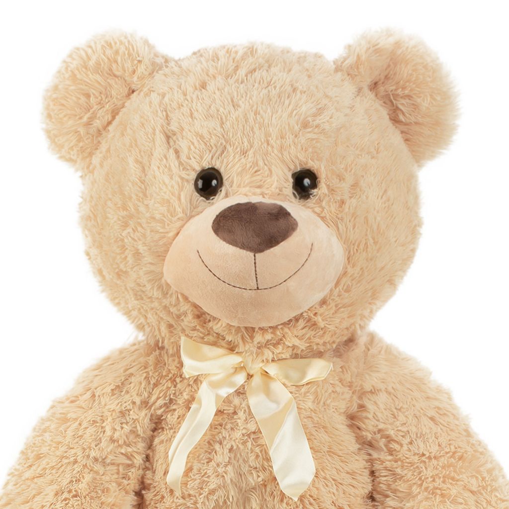 Close-up of a teddy bear's face and upper body.