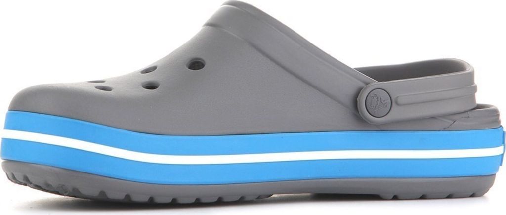 A side view of a gray Crocs shoe with blue and white stripes on the sole.