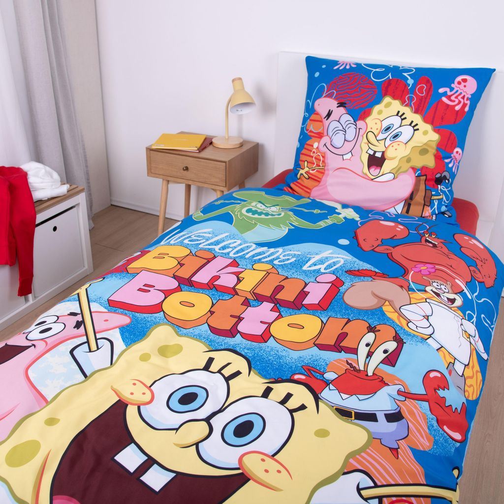 A Spongebob Squarepants themed bedding set is displayed on a bed in a bedroom setting.