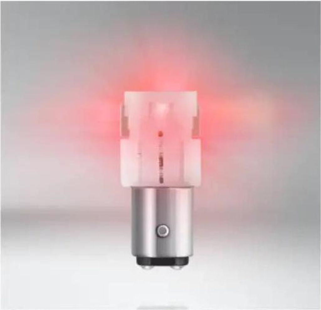 A single red LED automotive bulb on a light gray background.