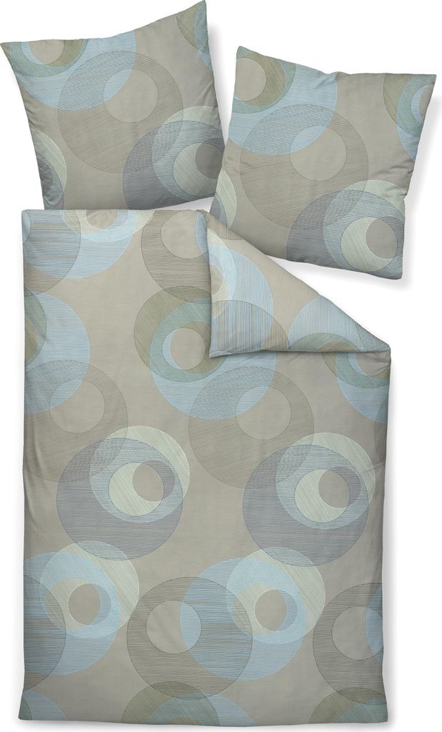 A bedding set with two pillowcases and a duvet cover, all featuring a circular pattern.