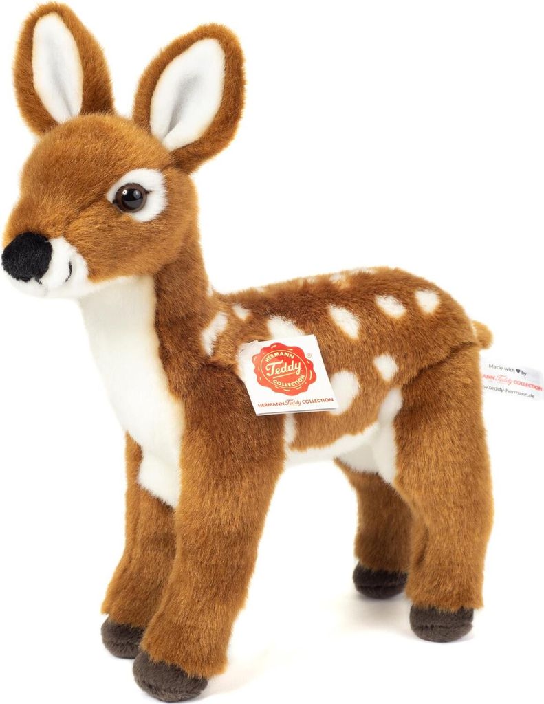 A plush toy deer standing on a white background.