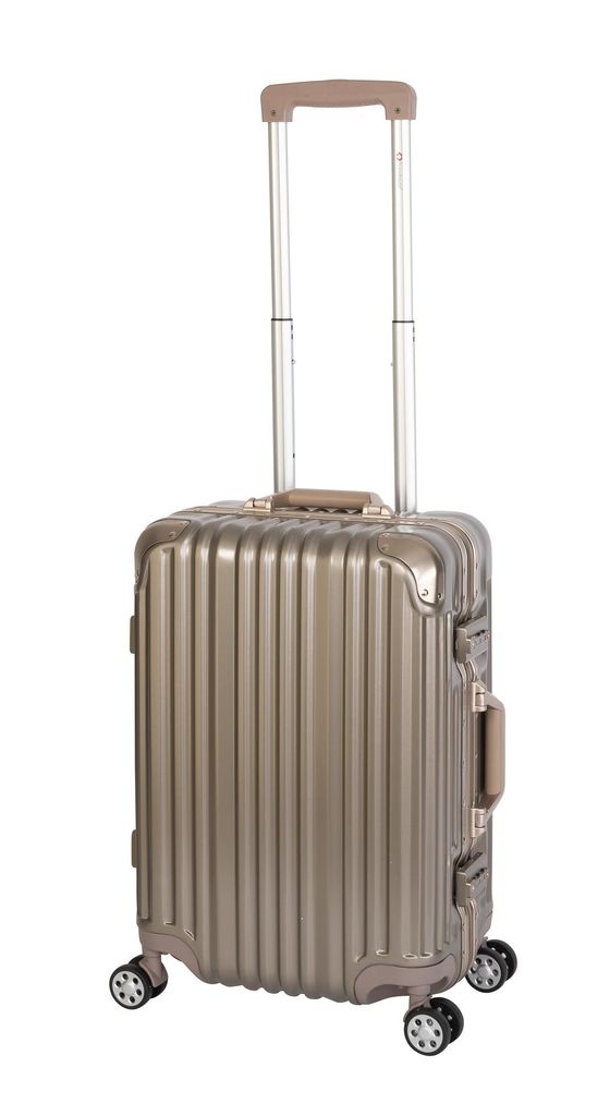 A gold-colored carry-on suitcase with a retractable handle and four wheels, isolated on a white background.