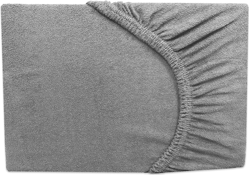 A close-up view of a grey fitted sheet with elastic gathering at the corner.